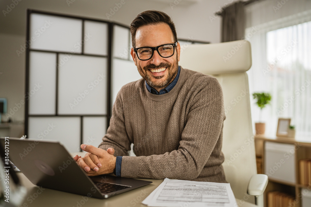 Portrait of one adult businessman sit and smile at office Portrait of one adult businessman sit and smile at office
