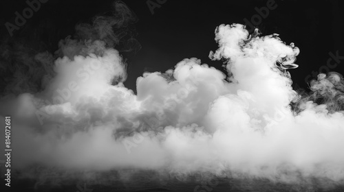 Mysterious dry ice fog creating an intense smoke effect on a dark black background, ideal for atmospheric scenes