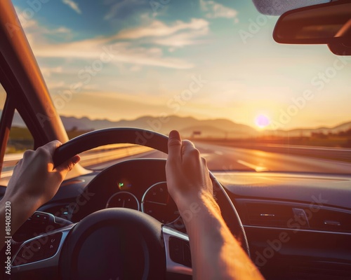 Drivers hands on steering wheel, sunset road trip in summer vacation, high quality image