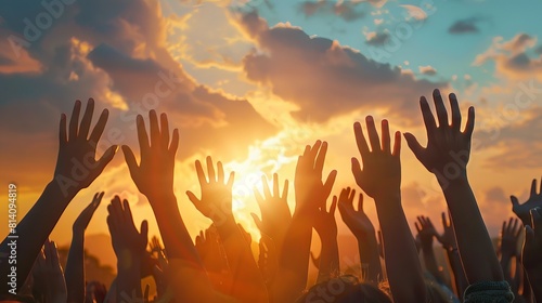 Hands to heaven, group of people with their hands up looking at the sunset 