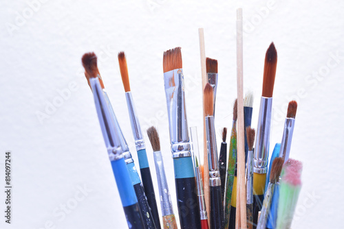 a set of dirty brushes and paintbrushes from having painted too much