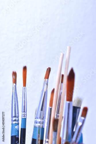 a set of dirty brushes and paintbrushes from having painted too much