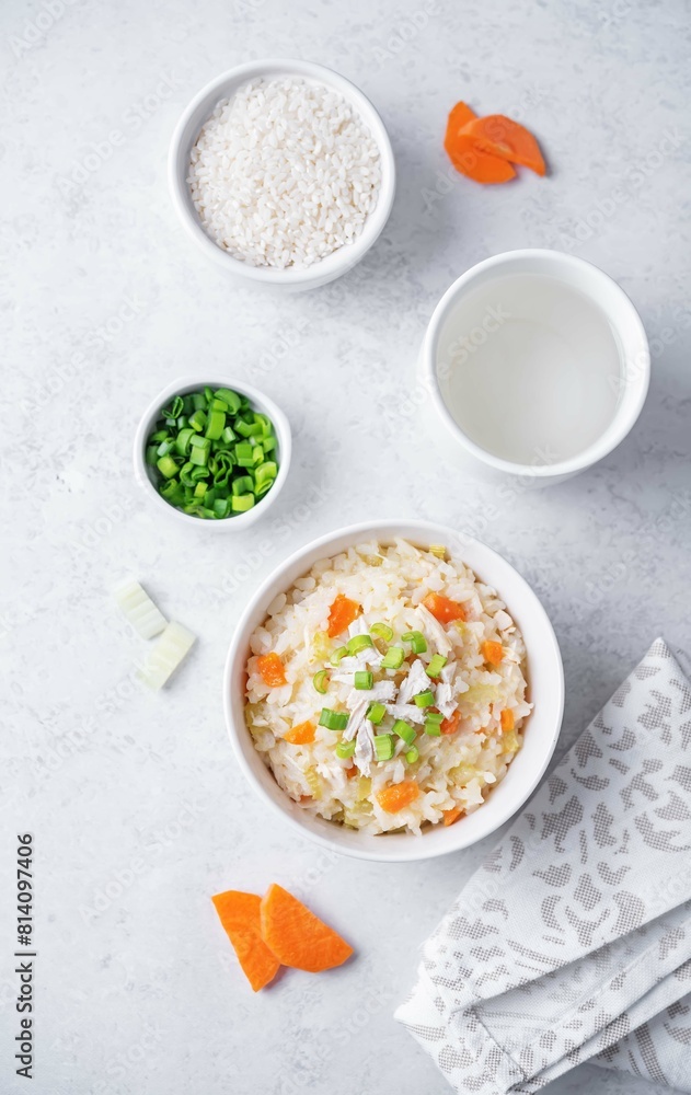 Asian rice chicken soup with carrots and celery in a bowl Asian rice chicken soup with carrots and celery in a bowl