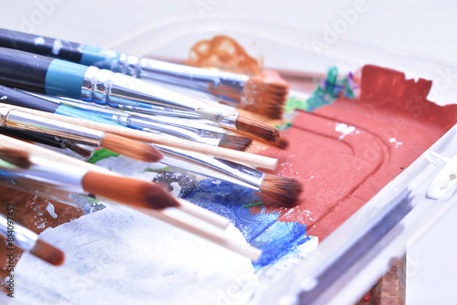 a set of dirty brushes and paintbrushes from having painted too much