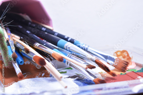 a set of dirty brushes and paintbrushes from having painted too much