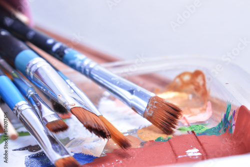 a set of dirty brushes and paintbrushes from having painted too much
