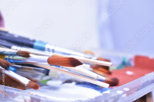 a set of dirty brushes and paintbrushes from having painted too much