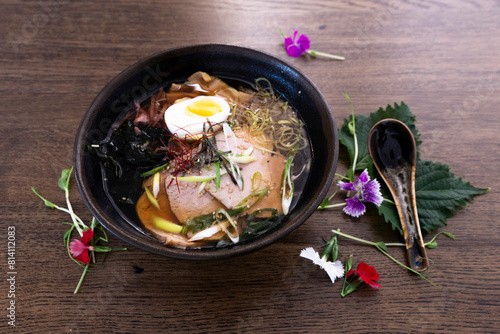 Ramen asiatic bowl on a wooden table