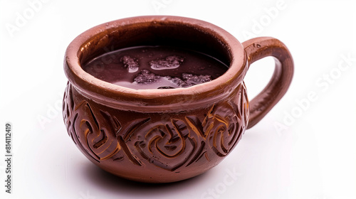 Peruvian chicha morada in a clay cup, isolated on white background 