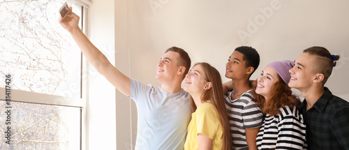 Teenagers taking selfie at home