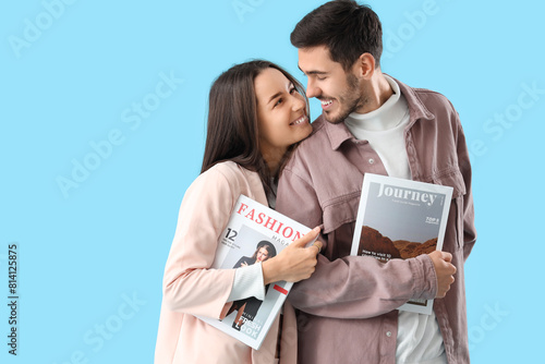Young couple with magazines...