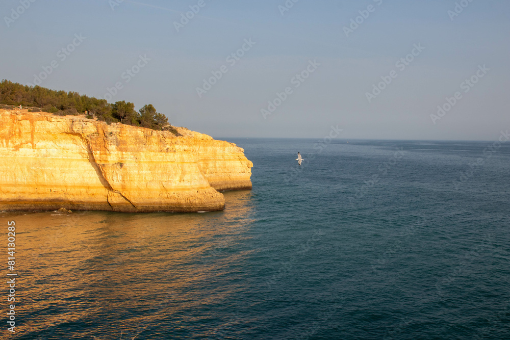View Cliffs along the Beach at Sunset in Albufiera Portugal View Cliffs along the Beach at Sunset in Albufiera Portugal