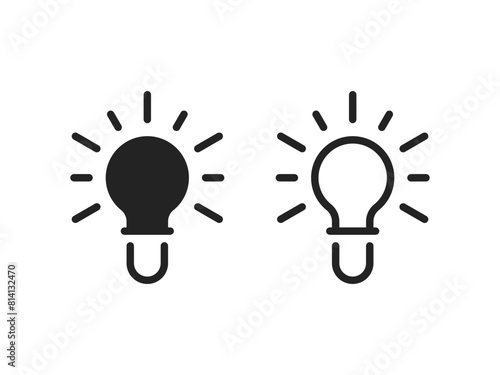 two simple black electricity light bulb icon