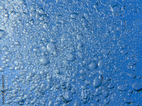 Air bubbles under the sea surface.