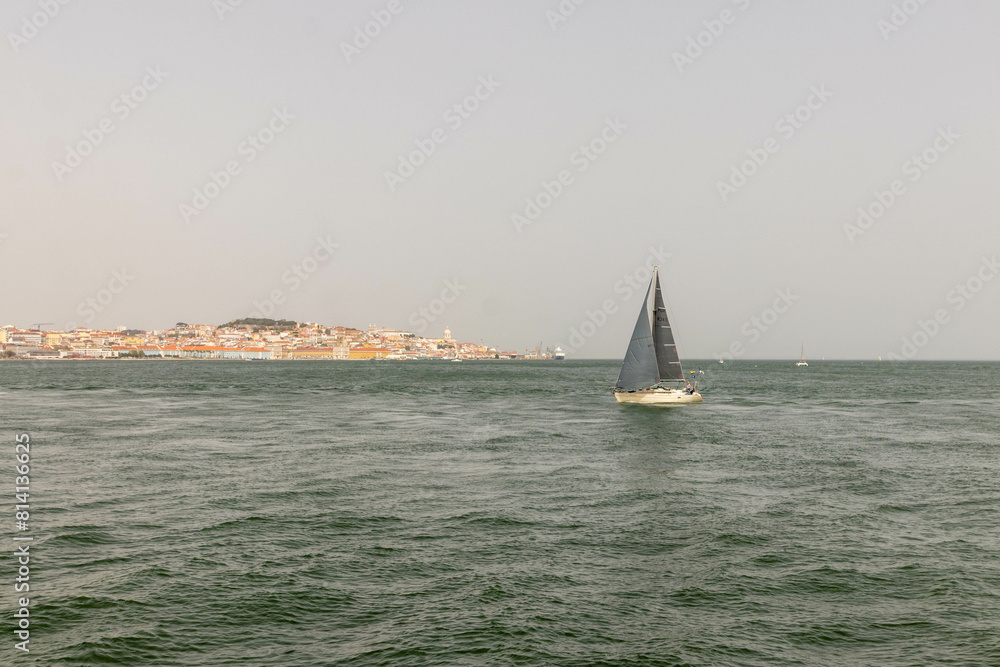 Sailboat Sailing Along the Coast of Lisbon Portugal