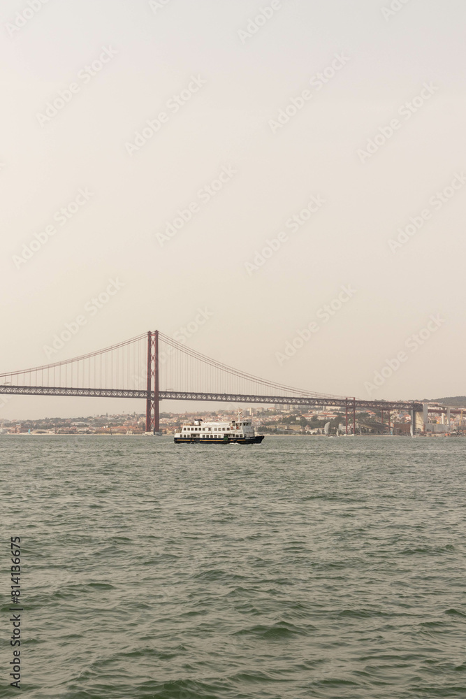 Naklejka premium View of a Bridge in Lisbon Portugal Along the Water