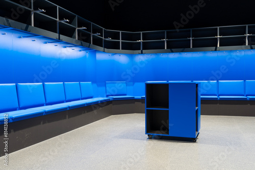 Modern empty sports locker room with blue furniture	 photo