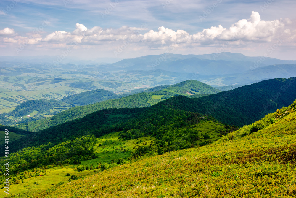 mountainous carpathian landscape of ukraine in summer. view from mountain pikui. borzhava ridge in the far distance