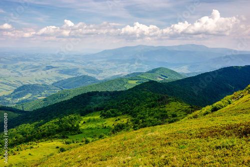 mountainous carpathian landscape of ukraine in summer. view from mountain pikui. borzhava ridge in the far distance