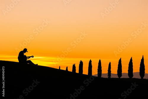 guitarist in Crete Senesi, Tuscany, Italy. breathtaking view, freedom, alone with yourself