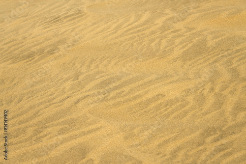 The texture of sand in the desert as a natural background. © Arthur
