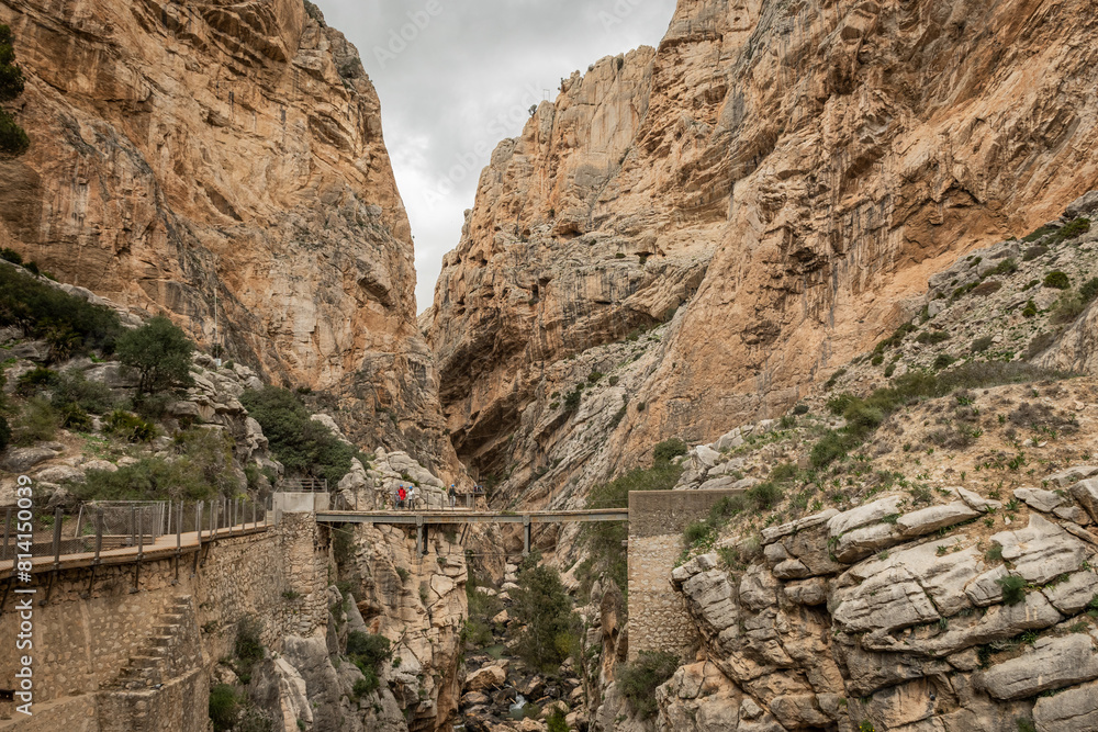 hiking trail caminito del rey, kings walkway, in Malaga Spain. narrow footpath leads through natural beauty mountain range cliff faces of gaitanes gorge. hisotric landmark popular tourist attraction hiking trail caminito del rey, kings walkway, in Malaga Spain. narrow footpath leads through natural beauty mountain range cliff faces of gaitanes gorge. hisotric landmark popular tourist attraction