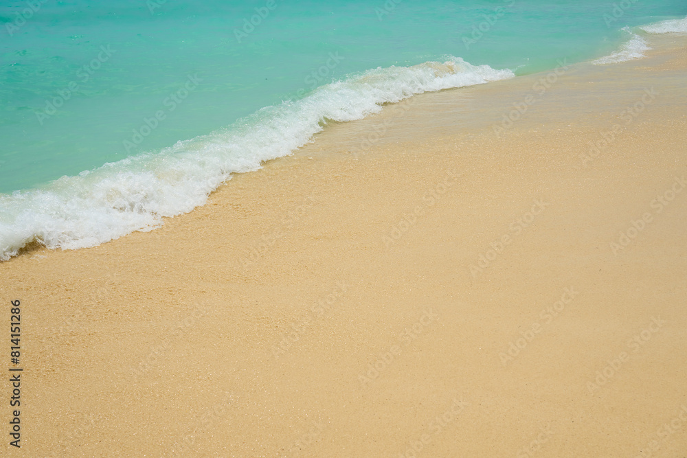 Waves and foam on a tropical sandy beach. Waves and foam on a tropical sandy beach.