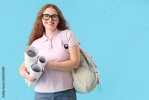 Happy female student with b...