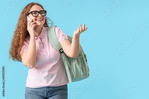 Happy female student with b...