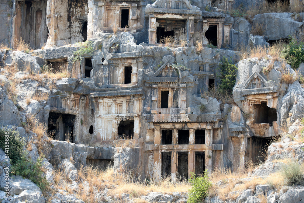 Rocks with caves for the burial of people. Ruins of the ancient city Myra. Lycia region, Antalya, Turkey.
