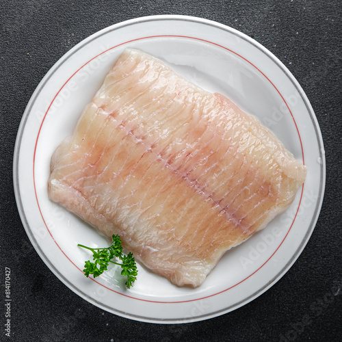raw white fish fillet giant sea bass and filleting grouper fresh cooking appetizer meal food snack on the table copy space food background rustic top view Pescetarian diet vegetarian food © Alesia Berlezova