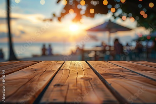  focus is on the wooden texture of a tabletop at a beachside bar, with a blurred background revealing thatched umbrellas, tropical trees, and the calm blue sea on a sunny day, holiday