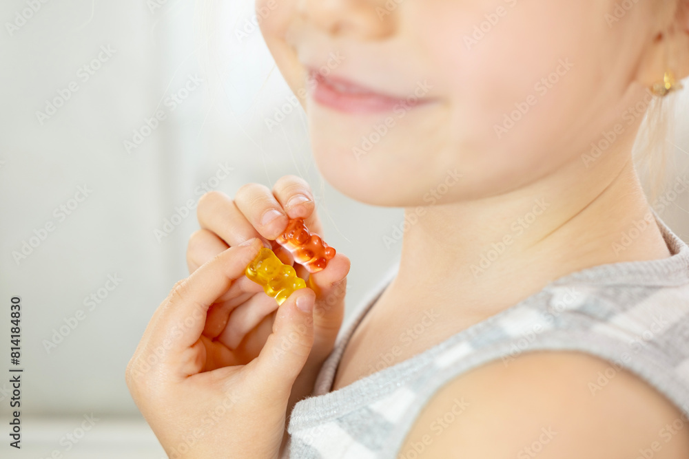 close-up preschool child, girl 5 years old wants eat gelatinous sweets, gummy bear, kid has good appetite, happy childhood, balanced diet, sweet life, unhealthy food, halal food close-up preschool child, girl 5 years old wants eat gelatinous sweets, gummy bear, kid has good appetite, happy childhood, balanced diet, sweet life, unhealthy food, halal food