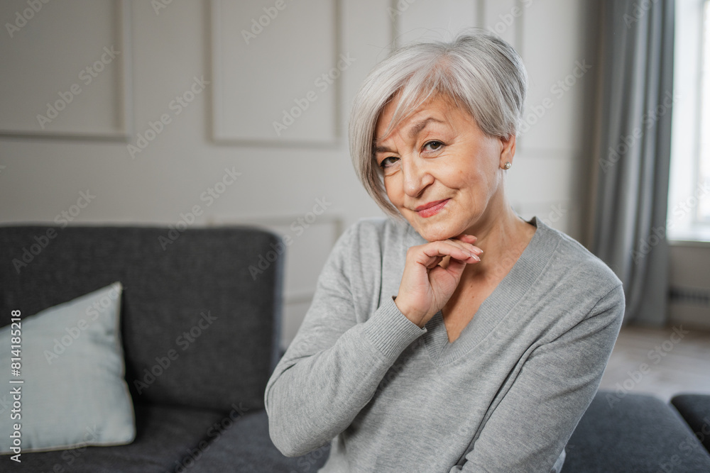 Portrait of confident stylish european middle aged senior woman. Older mature 60s lady smiling at home. Happy attractive senior female looking camera close up face headshot portrait. Happy people Portrait of confident stylish european middle aged senior woman. Older mature 60s lady smiling at home. Happy attractive senior female looking camera close up face headshot portrait. Happy people