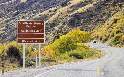 Sign for Goldfields Mining Centre and Jet on the Kawarau Gorge Road, State Highway 6, Otago, New Zealand. photo