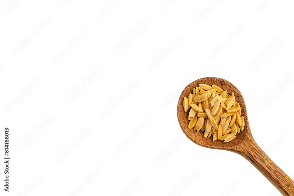 Risoni, organic pasta on spoon - Raw dried orzo Risoni, organic pasta on spoon - Raw dried orzo