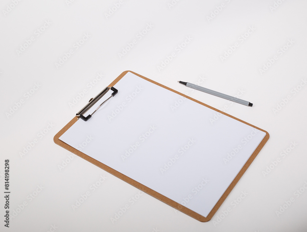 Wooden clipboard with blank white paper mock up with a pen Wooden clipboard with blank white paper mock up with a pen