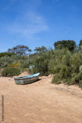 Blue boat on the beach near Cacela Velha, Algarve, Portugal photo