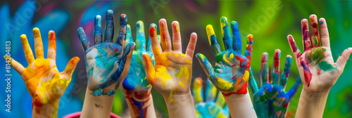Childrens Hands Covered in Colorful Paint
