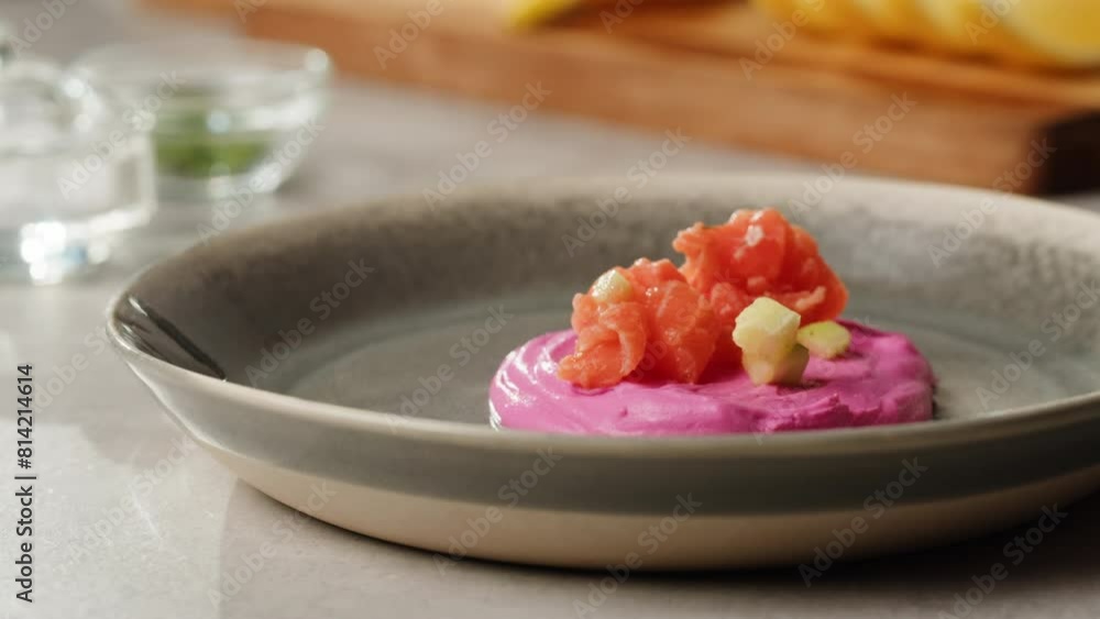 Chilean salmon tartar seviche with avocado and cucumber on purple cream cheese, onion Healthy diet food, close up red fish tar tar. Chilean salmon tartar seviche with avocado and cucumber on purple cream cheese, onion Healthy diet food, close up red fish tar tar.