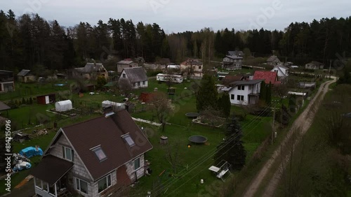 Wallpaper Mural Aerial view of village with houses, trees, and asphalt roads nestled in nature Torontodigital.ca