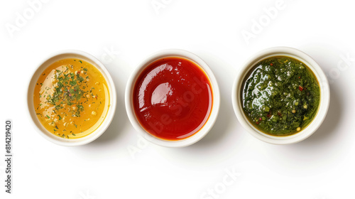 top view of a variety of sauces in a three white bowls
