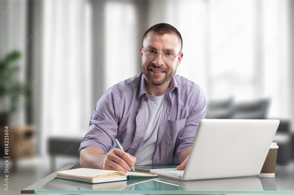 Business man sitting in an office at work Business man sitting in an office at work