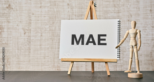 There is notebook with the word MAE. It is an abbreviation for Mean Absolute Error as eye-catching image. photo