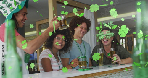 Image of clover icons over diverse friends drinking beer