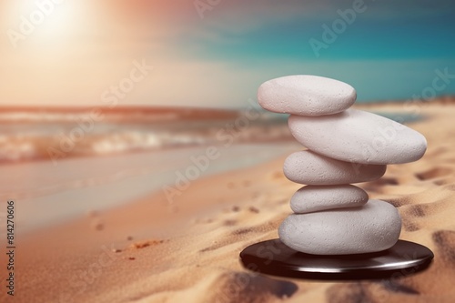 Balanced rock on sea beach at sunny day