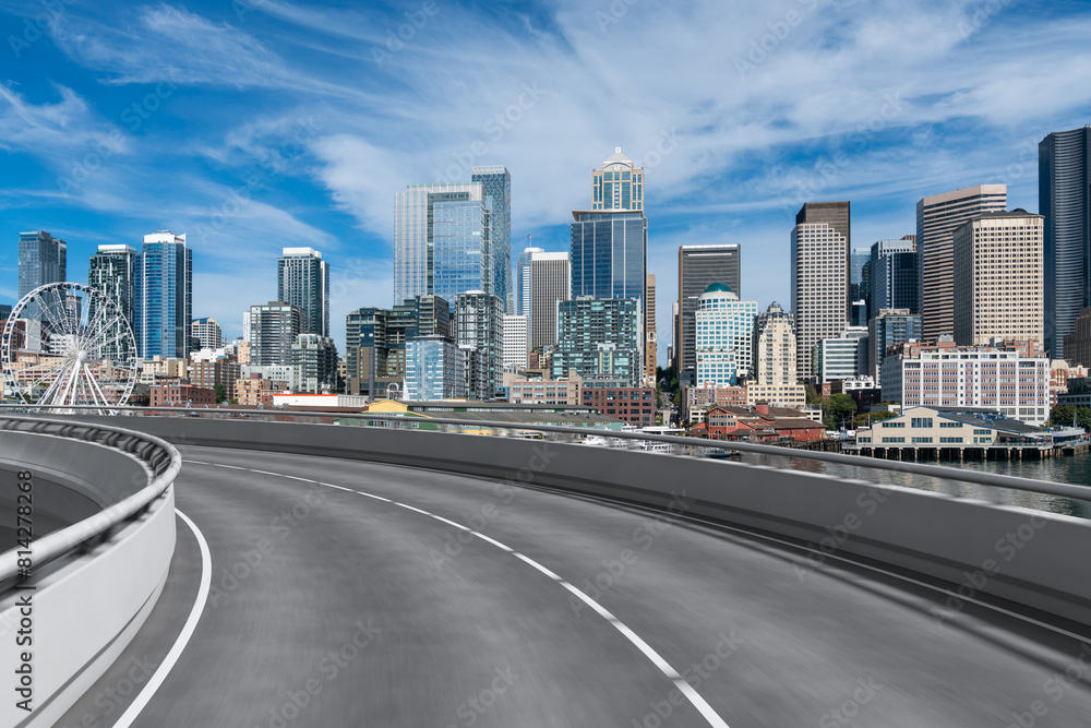 Empty urban asphalt road exterior with city buildings background. New modern highway concrete construction. Concept way to success. Transportation logistic industry fast delivery. Seattle. USA.