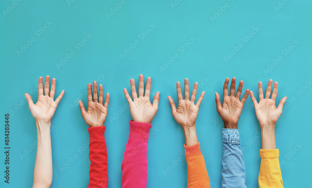Diversity Multi Ethnic Raised Children's Hands on a Plain Studio Backdrop with Copy Space Diversity Multi Ethnic Raised Children's Hands on a Plain Studio Backdrop with Copy Space