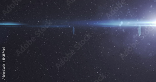 Image of glowing lights over night sky with stars