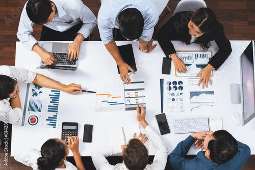 Top view project manager communicate and collaborate with team using project management software, tracking progress of project task and making schedule plan at meeting table. Prudent photo